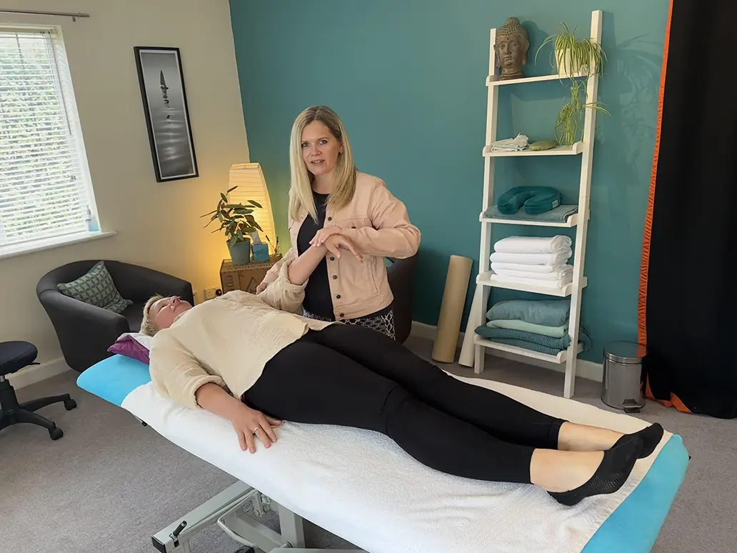 Sarah with client using arm
