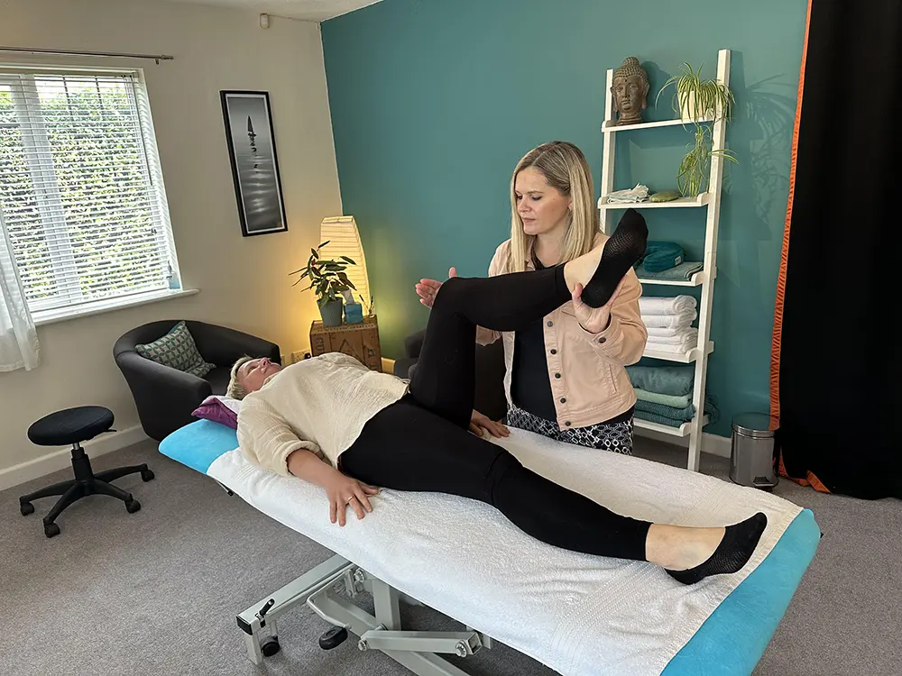 Sarah with client using leg